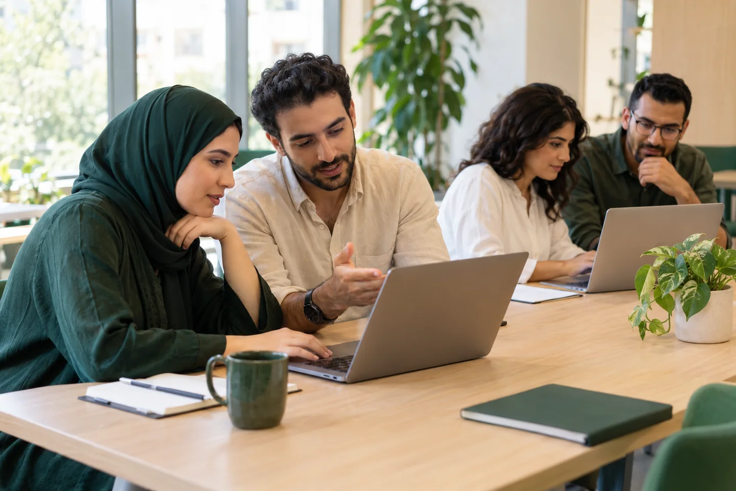 Conceptual photograph of adults learning together in a practical digital workshop